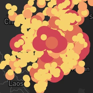 Overlapping red and yellow circles obscuring a coronavirus outbreak map